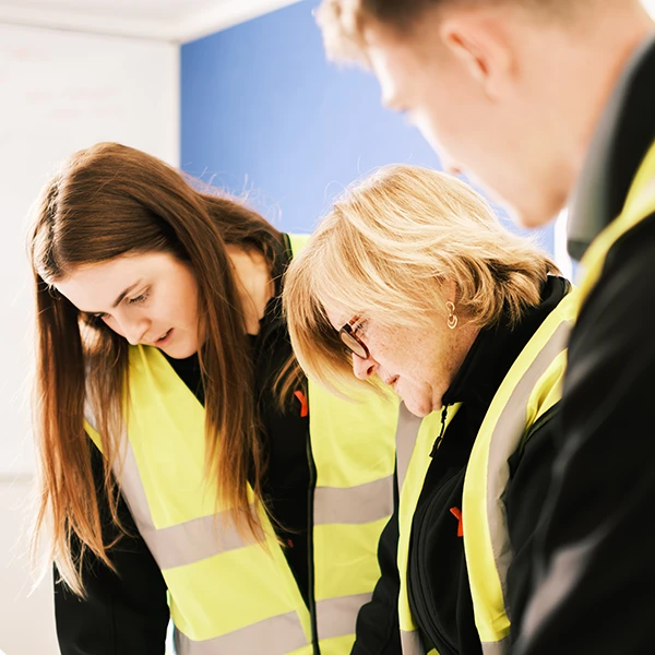 student and employer wearing hi vis vests