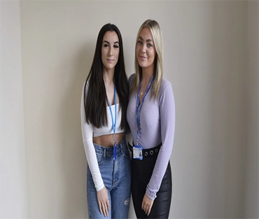 Elana and Katie standing together smiling