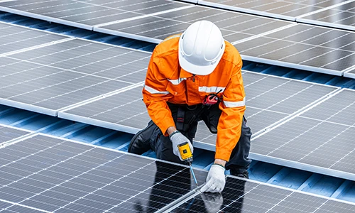 Technician installing solar panels 