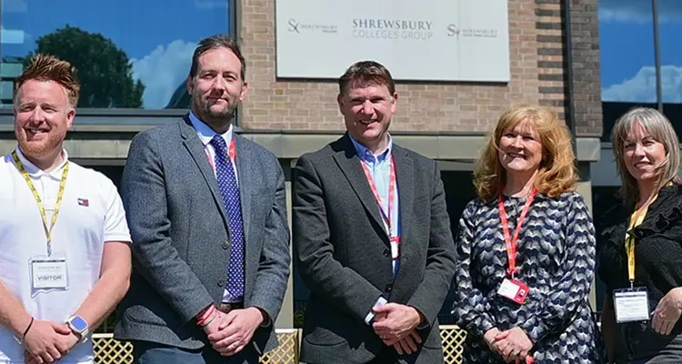 Senior Leadership team with employers at Reech standing outside the front of London Road Campus