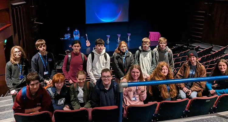 Group of students standing together smiling