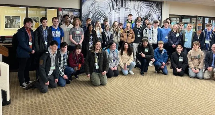 Large group of students standing together smiling