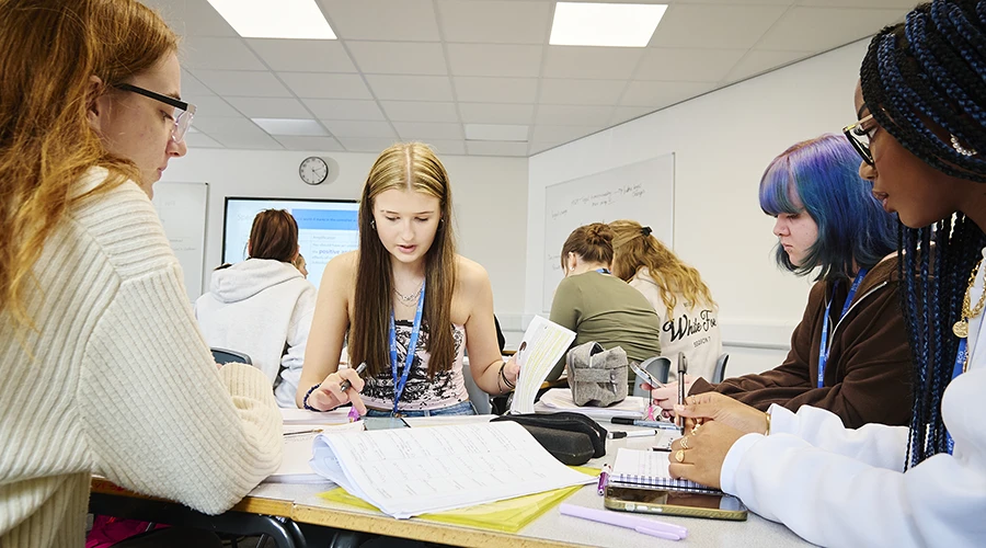 Students reading books and writing