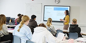 Students in classroom watching presentation 