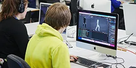 Student at computer using 3D modelling software 