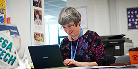 Mature student at laptop